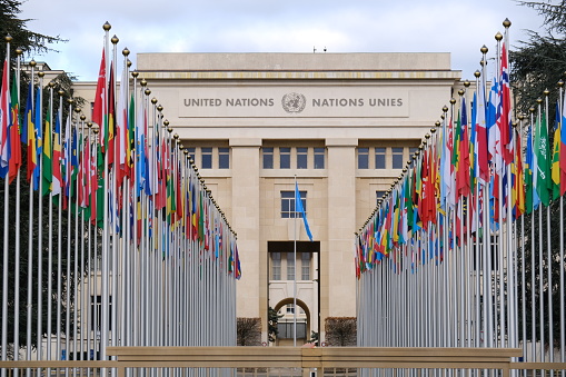 New York, NY, USA - June 7, 2022: Country flags flying in front of the United Nations Secretariat building.