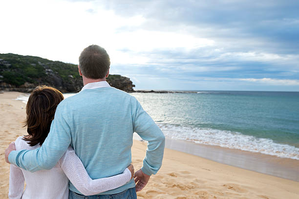 istock Mature couple looking at the sunrise 187068661