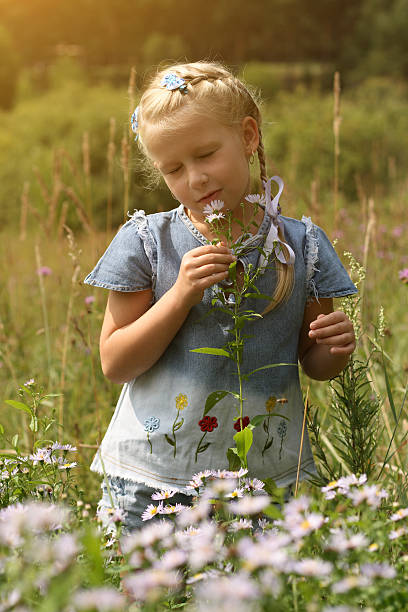 istock Girl on summer meadow 187068831