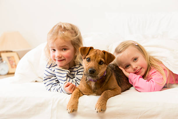 istock Girls and Their Dog 187068846