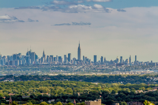 View on the skyline of Midtown Manhattan from Eagle Rock Park, with the forests of New Jersey in the foreground