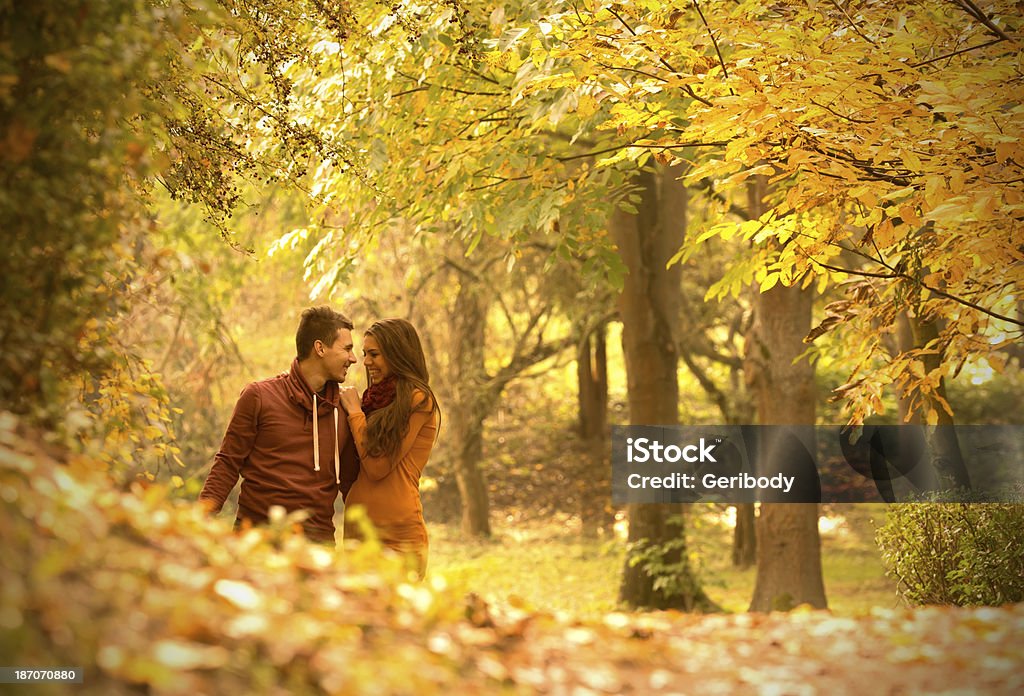 passionate love in the autumn park Adult Stock Photo