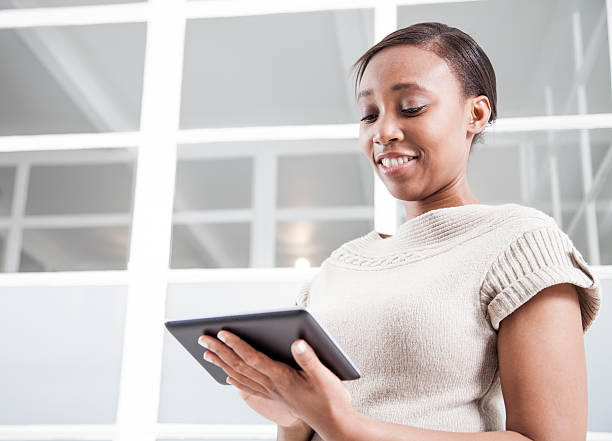istock African businesswomen working on her new tablet. 187070966