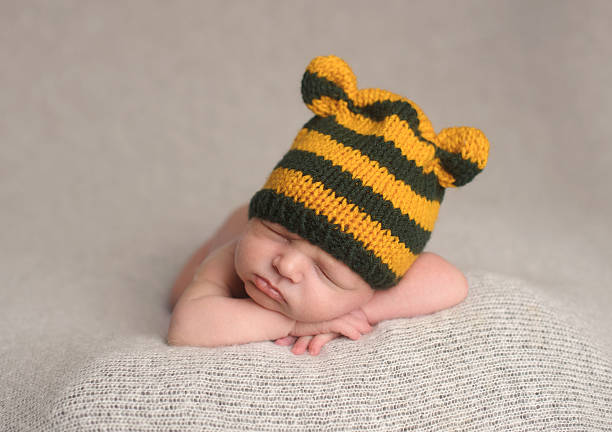 istock Sleeping Newborn Boy in Knit Hat 187071302