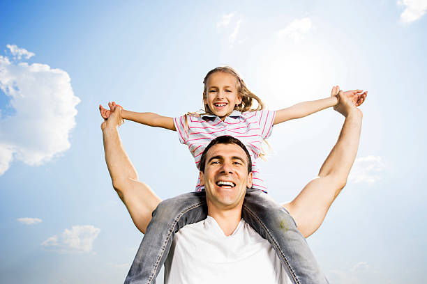 istock Playful father and daughter against the sky. 187071304