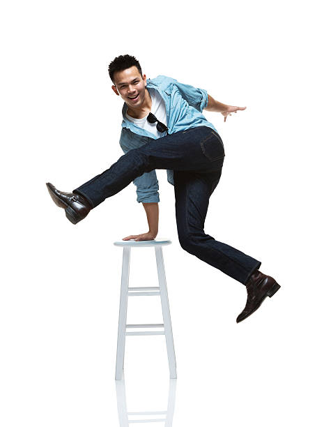 istock Young man jumping in white background 187071425