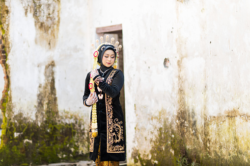 Portrait of a woman with Indonesian bridal makeup. Traditional royal wedding female dress from Indonesia
