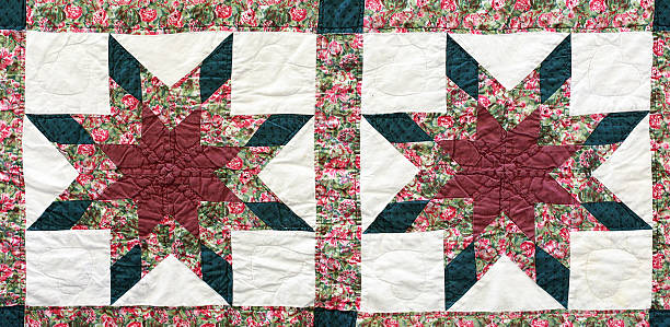 istock Antique handquilted star pattern.  Red, green, maroon, white. 187071727
