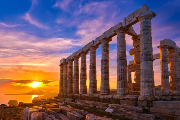 Sunset sky and ancient ruins of temple of Poseidon, Sounion, Greece Beautiful sunset sky and ancient ruins of temple of Poseidon, cape Sounio, Aegean sea coast, Greece. Travel destination of Athens area, important center of ancient Greek religion for Olympian Greek mythology, god of the sea and earthquakes, headland stock pictures, royalty-free photos & images