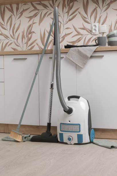 small and simple vacuum cleaner in the apartment - appliance living room domestic room lifestyles imagens e fotografias de stock