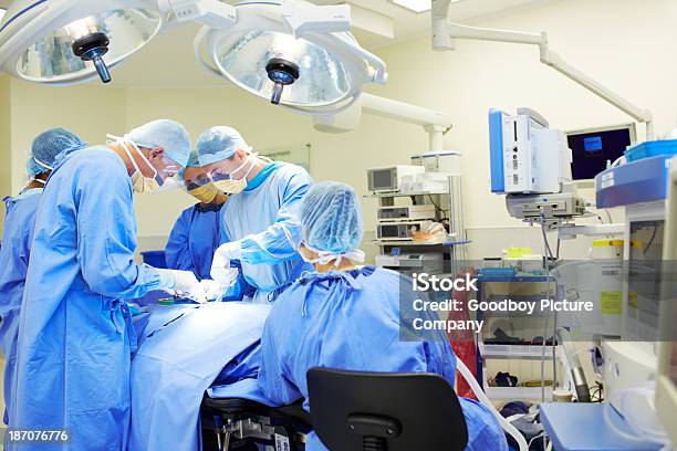 Performing A Complex Procedure Stock Photo - Download Image Now - Accidents and Disasters, Adult, Adults Only
