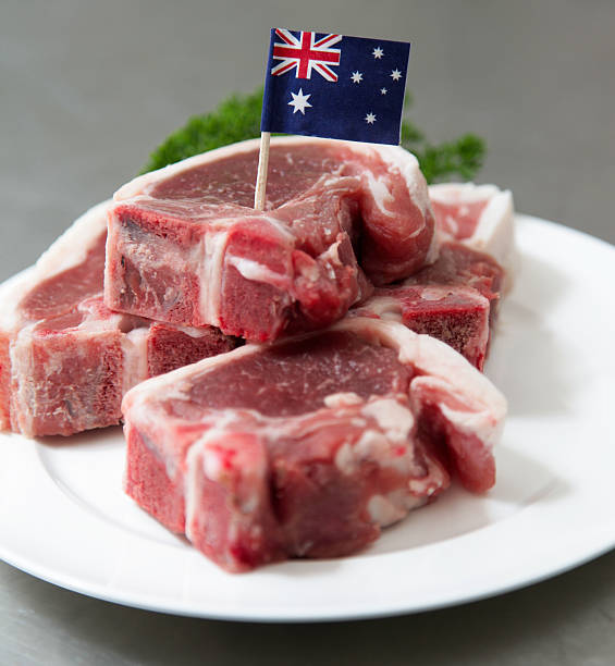 istock Raw Australian lamb chops on a white plate 187077186