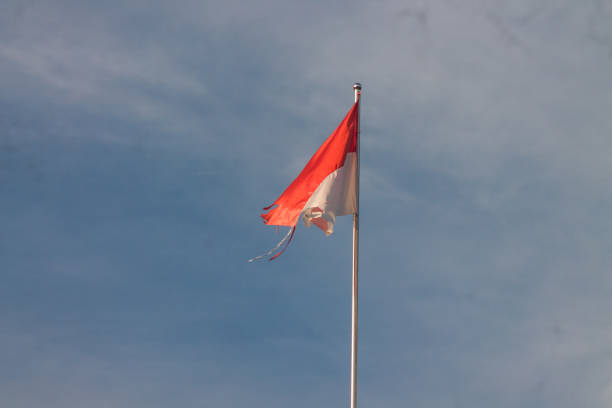 istock Old Indonesian flag on the wind 1870774444