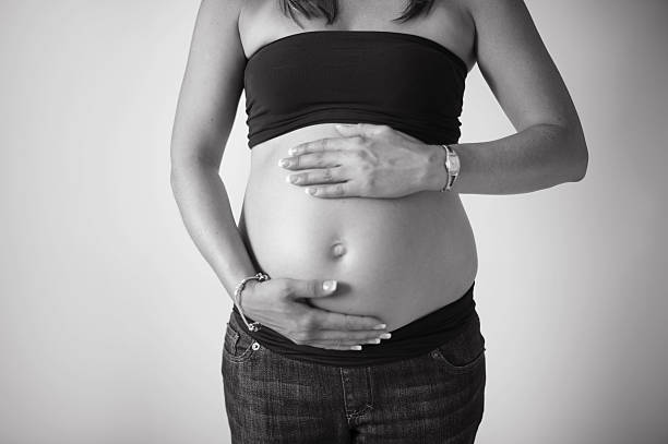 istock Closeup of Pregnant Mom's Belly 187077458