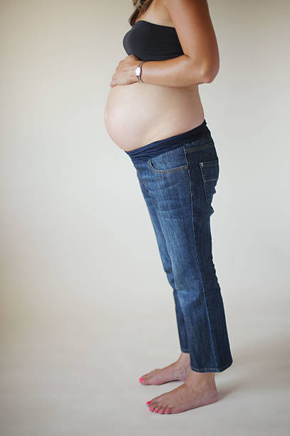 istock Pregnant Mother Holding Belly 187077569