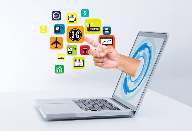 istock Hand from laptop screen touching social media icons 187078124