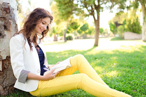 istock Teenage girl reading book 187078166