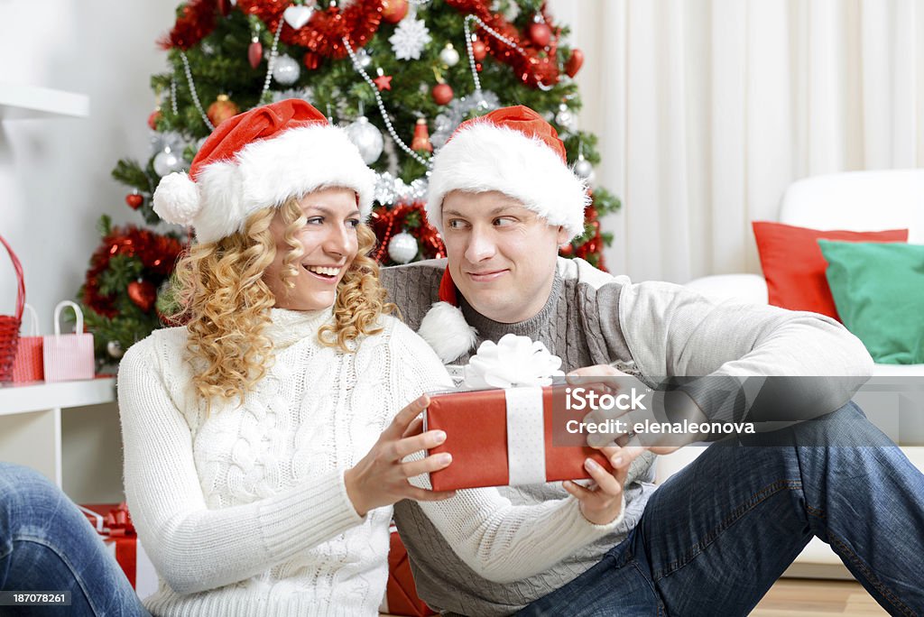 happy young couple happy young couple in a Christmas interior 25-29 Years Stock Photo