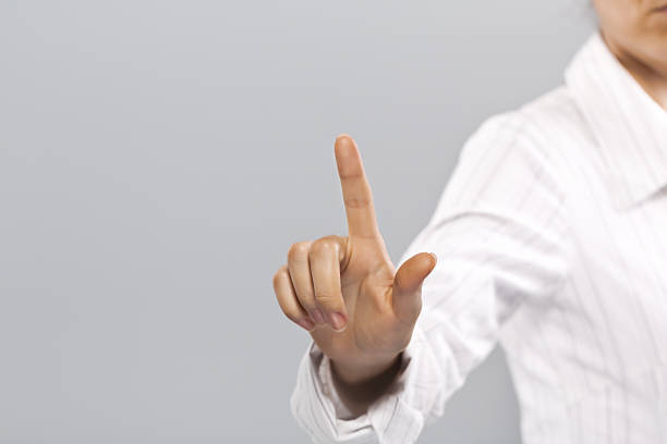 istock Businesswoman pressing button on touch screen 187079403