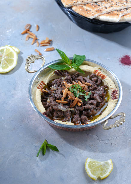 istock An iron plate containing hummus with shawarma and special roasted almonds 1870799411