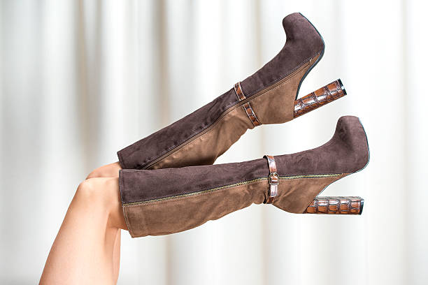 istock Woman´s legs in brown High Heels Boots 187080552