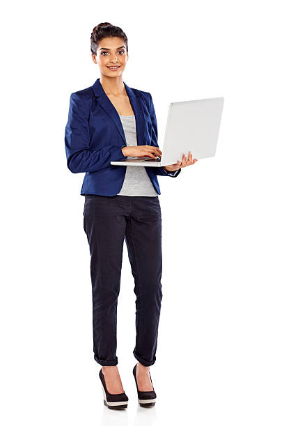 istock Young female executive standing with a laptop 187081833