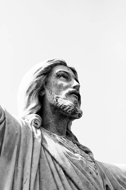 istock Jesus Christ, wetahered old statue against white background, copy space 187081850