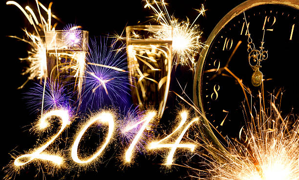 istock Champagne Glasses Infront Of Fireworks With Sparkling 2014 And Clock 187081896