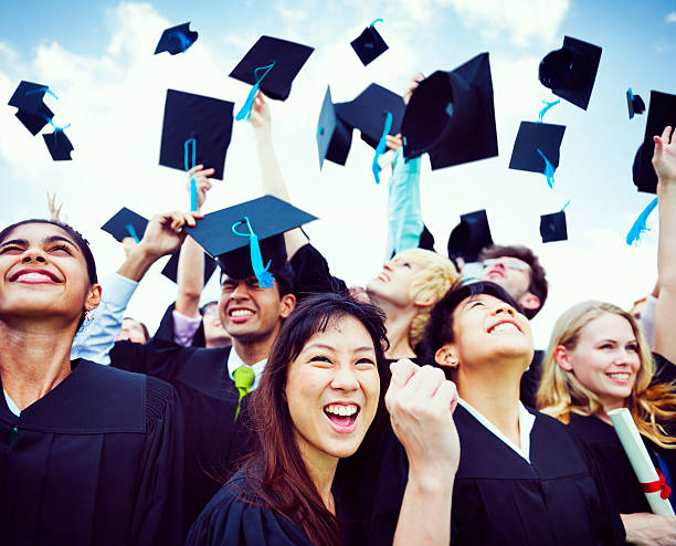 istock Graduation Caps Thrown in the Air 187082415