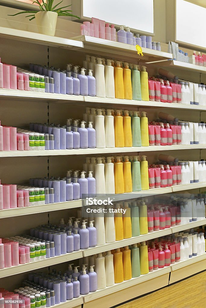 Cosmetic store shelf Large shelf inside retail cosmetic store with colorful bottles Shelf Stock Photo