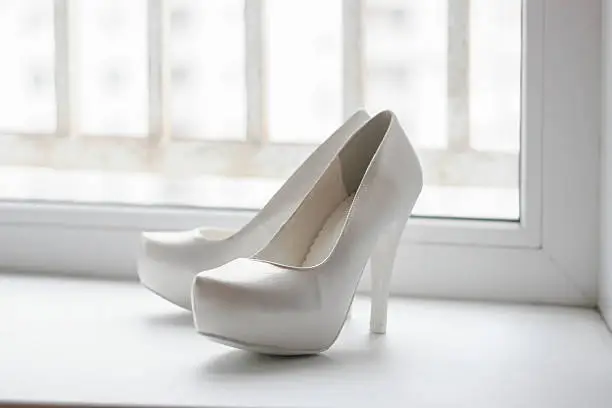 Side view of women's fashion shoes (pair) with high heels