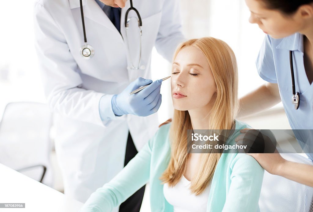 male plastic surgeon with patient bright picture of male plastic surgeon with patient Adult Stock Photo