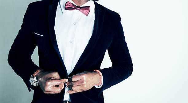 istock Torso of a sharply dressed man buttoning his suit jacket 187084022