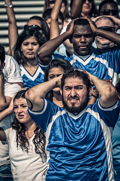 istock Blue supporting fans in dispair with their teaming losing (I) 187084233