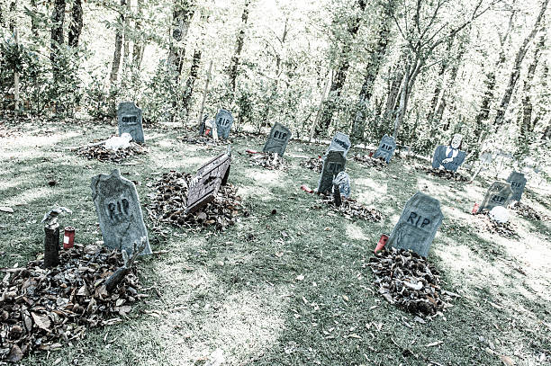 istock Halloween Graveyard with Zombie Raising Dead 187084421