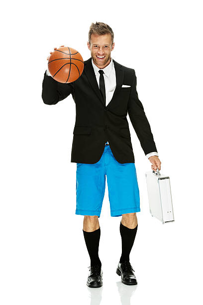 istock Businessman walking with basketball 187085966