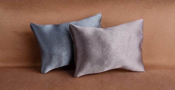 Shiny silk cushions on a sofa