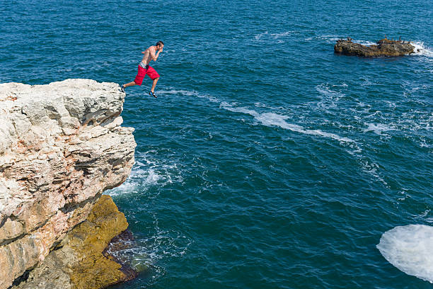 istock Jumping in the sea 187087221