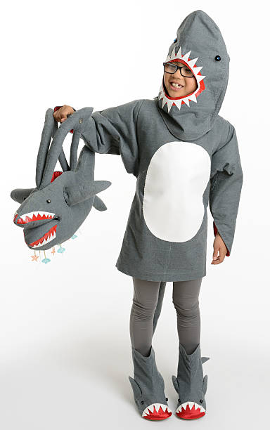 Young Girl in Halloween Shark Costume stock photo