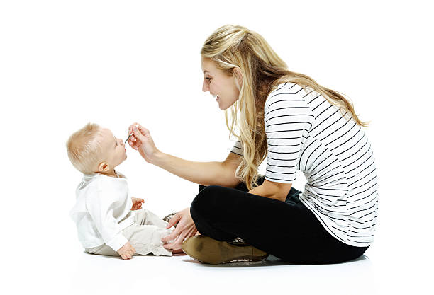 istock Mother feeding her baby 187087552