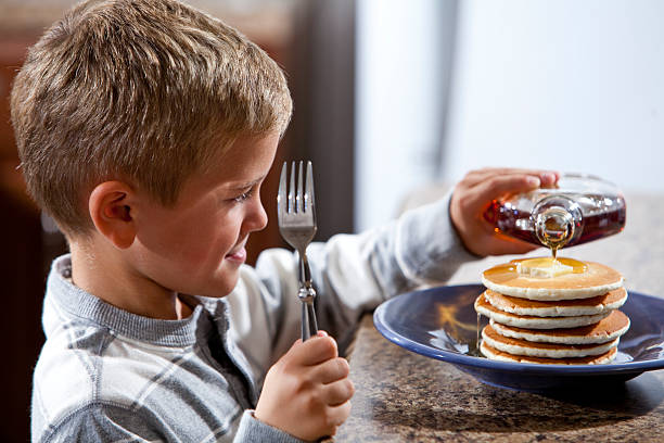 Whole Wheat Pancakes with Syrup and Butter,Coffee and Orange Juice -Photographed on a Hasselblad H3D11-39 megapixel Camera System