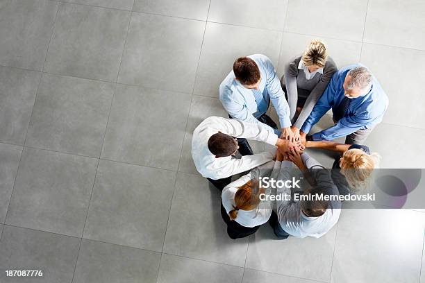 Photo Of Business People With Hands On Top Stock Photo - Download Image Now - Circle, Directly Above, Group Of People