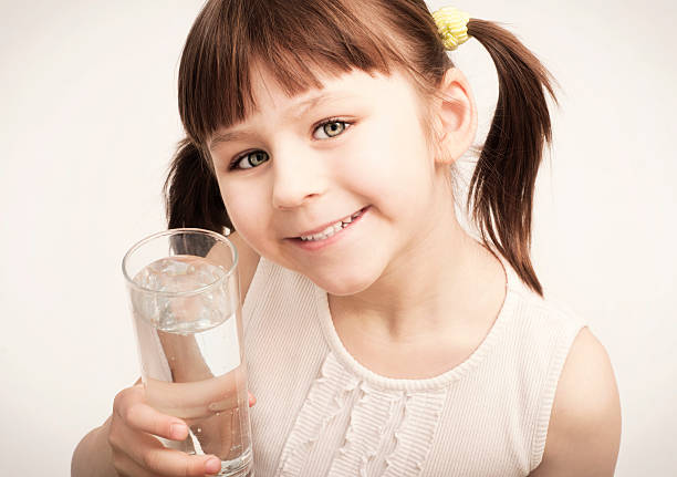 istock Little girl drinking water 187088265