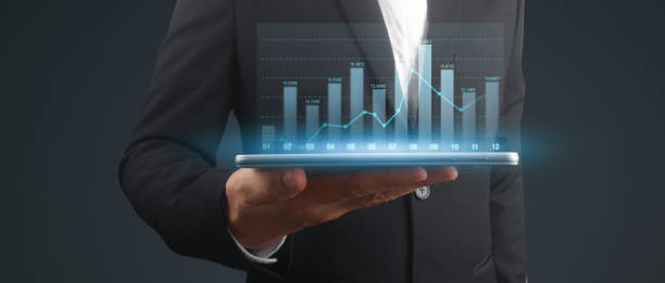istock Businessman plan graph growth and increase of chart positive indicators,tablet in hand 1870883378