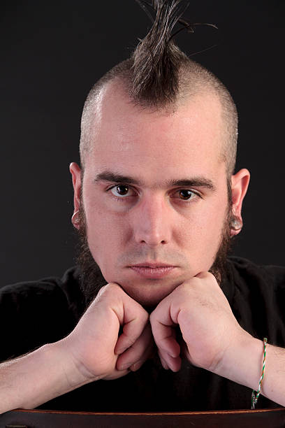 istock Young Man With a Mohawk Looking Directly at the Camera 187088665