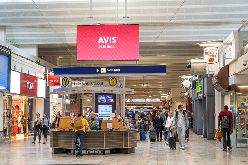 Minneapolis, USA - June 10, 2023. Travelers walking at the terminal of Minneapolis St Paul International Airport, Minnesota, USA