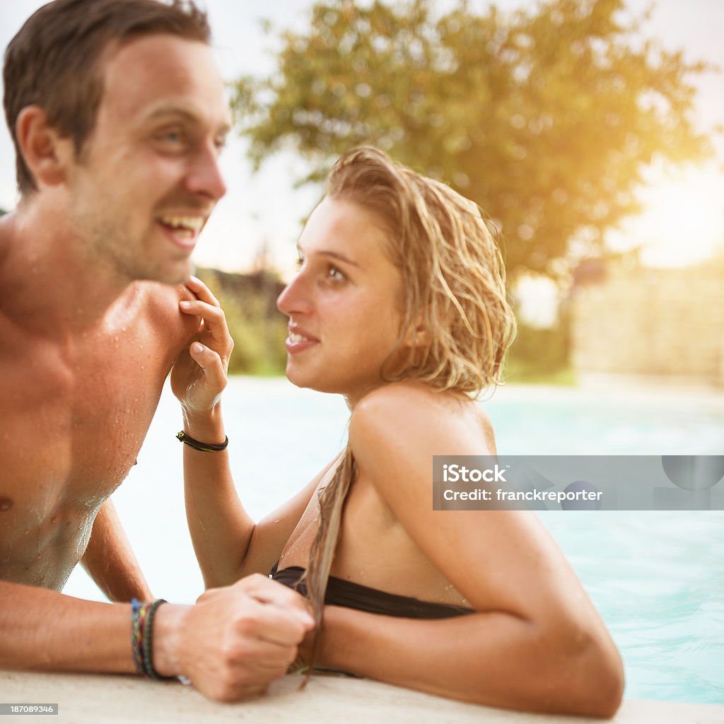 couple on the swimming pool have fun http://blogtoscano.altervista.org/sw.jpg  20-29 Years Stock Photo