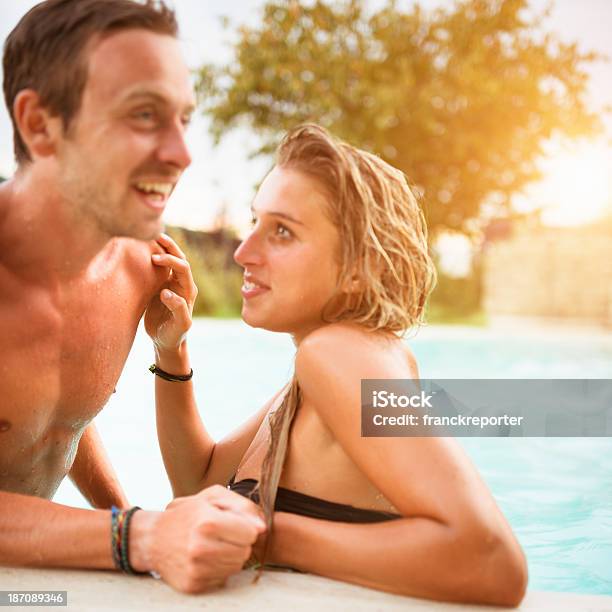 Couple On The Swimming Pool Have Fun Stock Photo - Download Image Now - 20-29 Years, Adolescence, Adult
