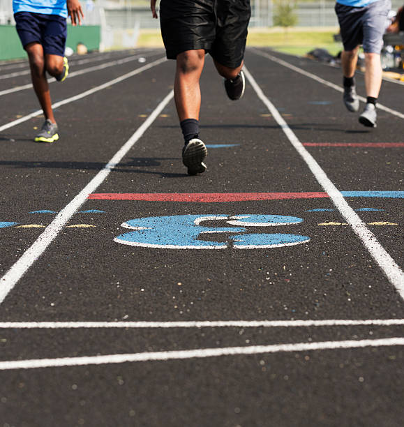 istock Sports: Three high school boys run a track race. 187089347