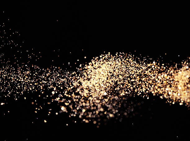 istock Abstract background with gold glitter on black 187089372
